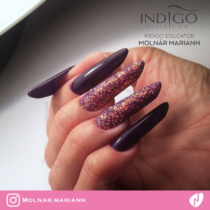 Female hands with dark purple nail design. Stock Photo | Adobe Stock