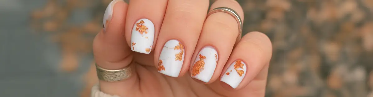 Elegant gold leaf and cloud dancer nail art