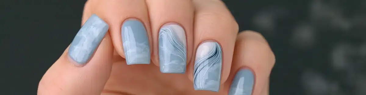 Powder blue and cloud dancer winter sky nail art