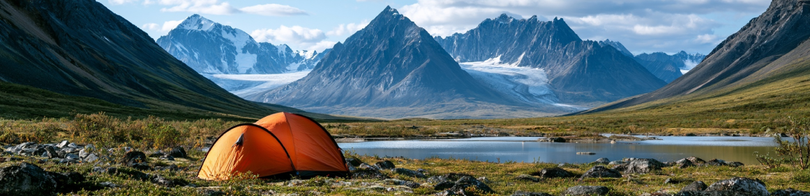Scenic Yukon highway winding beneath Kluane mountain ridges