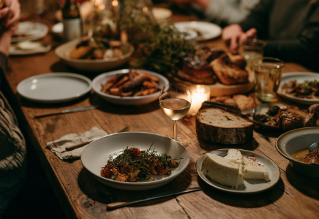 Warm dinner table with artisanal food and natural wine in a Quebec bistro