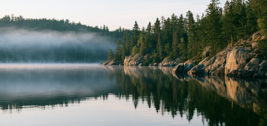 Canadian Shield granite lake reflections and mist