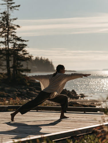 Outdoor yoga movement on coastal deck